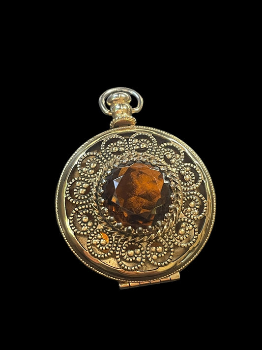 1975 Avon Gold Tone Victorian Style Necklace Pendant Locket with Amber Color Glass Stone