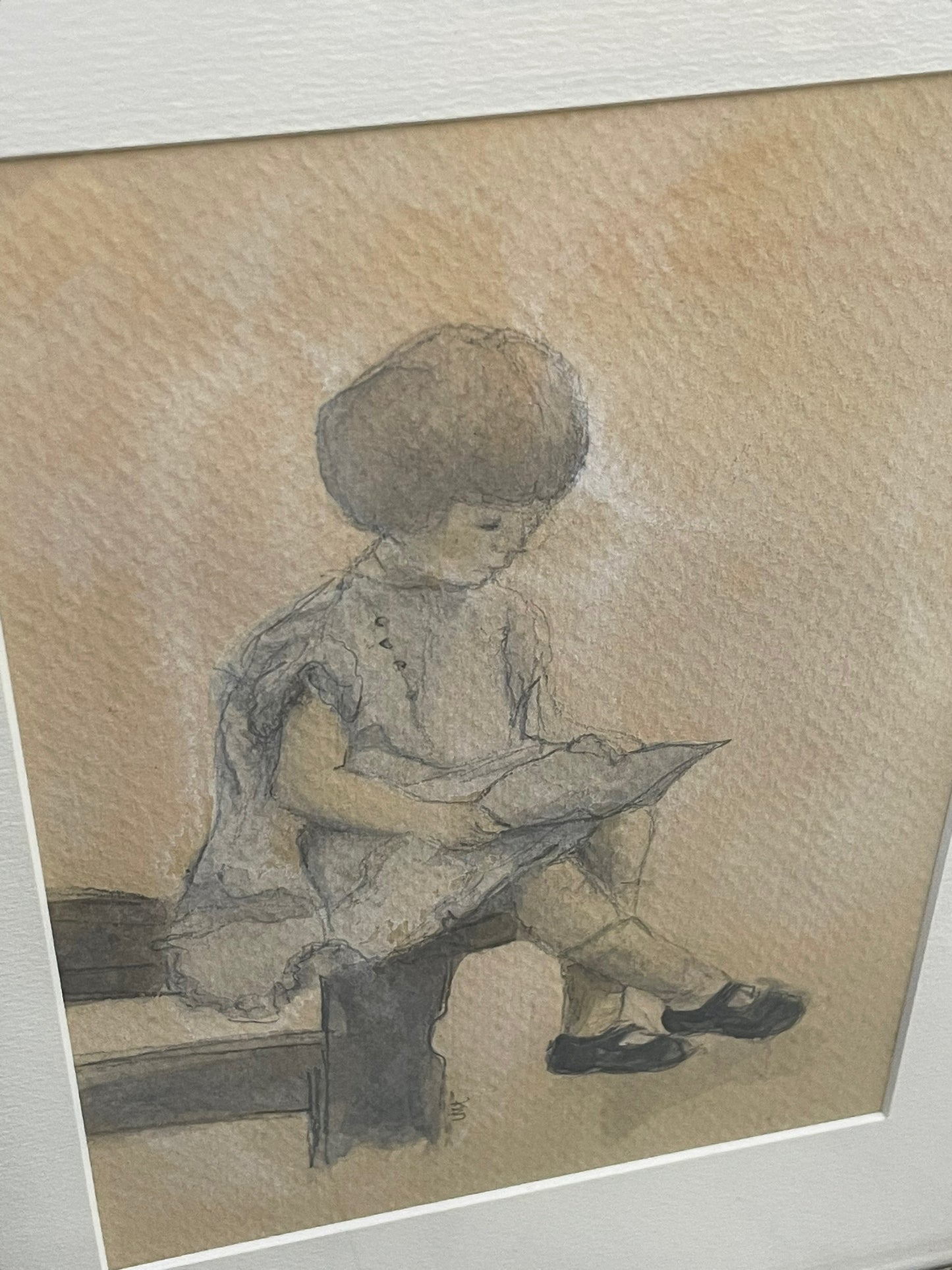 Framed Watercolor Artwork of a Girl Sitting on a Fence Reading a Book