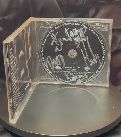 Autographed Korn "Life is Peachy" Album Booklet and CD